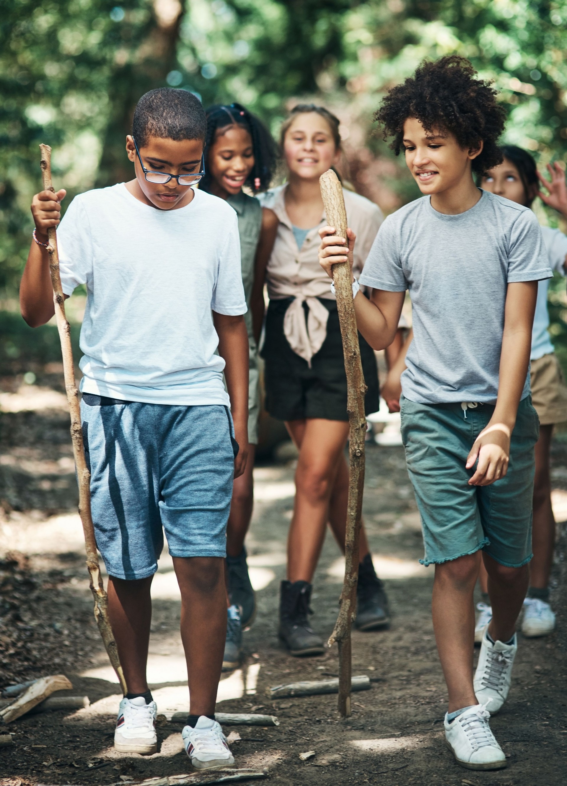 Shot of a group of teenagers exploring nature together at summer camp